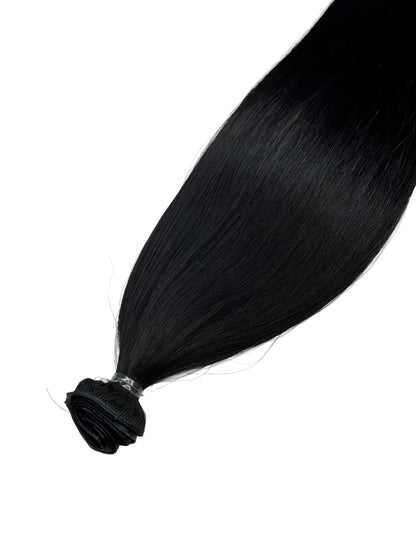Black hair extension on a white background